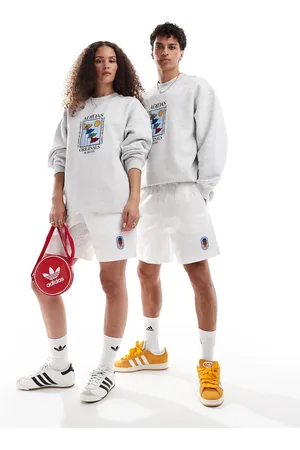 adidas Pantalones cortos blancos unisex con logo de