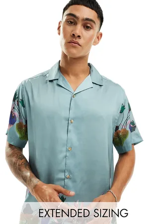 ASOS Camisa holgada con cuello de solapas y estampado floral en el borde de