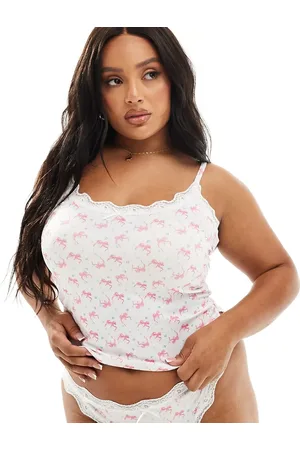 ASOS Conjunto de top de tirantes y braguitas con estampado de florecitas y lazos de canalé Cassie de ASOS DESIGN Curve-Blanco