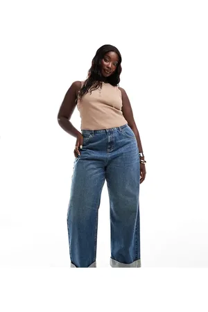 ASOS Vaqueros azul medio sueltos con dobladillos anchos de ASOS DESIGN Curve