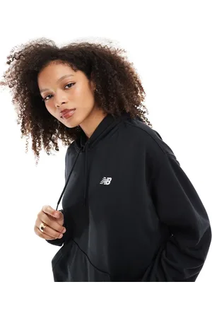 New Balance Sudadera negra básica con capucha de felpa de rizo Sport Essentials de