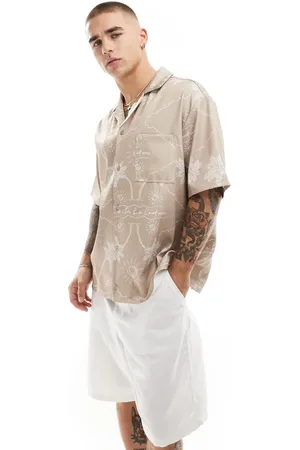 The Couture Club Camisa beis con estampado de palmeras bordado de