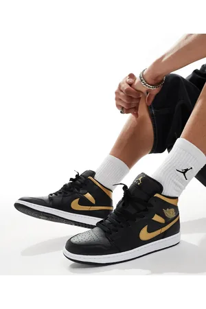 Jordan Zapatillas de deporte negras y doradas Air 1 Mid de