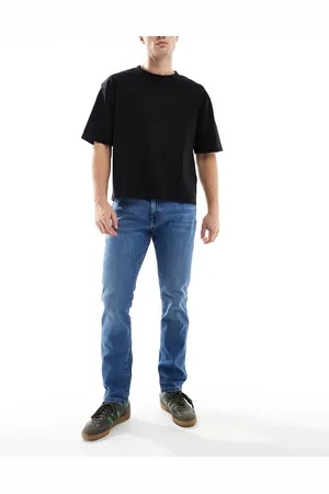 Wrangler Vaqueros de corte tapered slim con Larston de -Azul