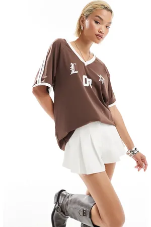 Lioness Top de estilo deportivo con cuello de pico y ribetes blancos en contraste de