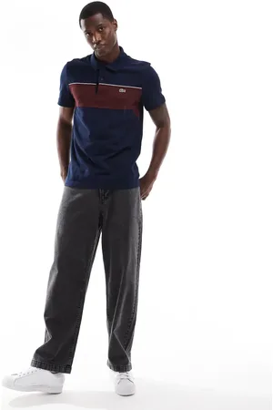 Lacoste Polo con diseño color block y logo de