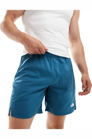 The North Face Pantalones cortos azules con logo 24/7 de