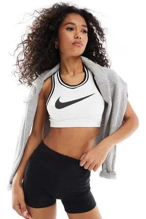 Nike Sujetador deportivo de sujeción ligera con logo de punto de
