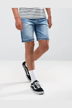 ASOS Shorts vaqueros de corte slim en azul lavado medio con detalle de paneles cosidos de ASOS
