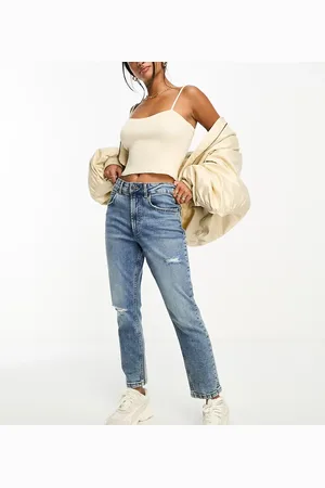 ASOS Vaqueros mom cómodos de corte slim con diseño rasgado de ASOS DESIGN Petite