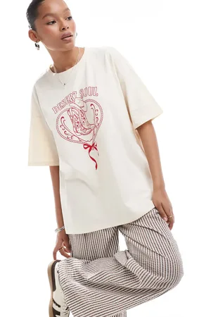 ASOS Camiseta color extragrande con estampado gráfico de herradura y bota de cowboy de -Blanco