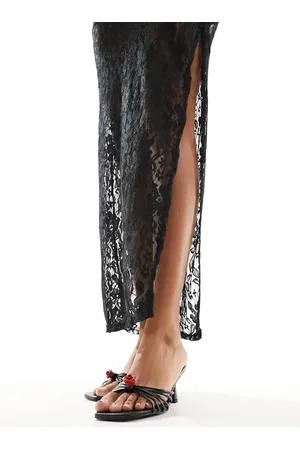 Public Desire Mules negras de tacón medio con detalle de rosa Vertigo de