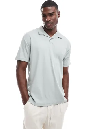 ASOS Polo verde claro holgado con solapas de canalé de