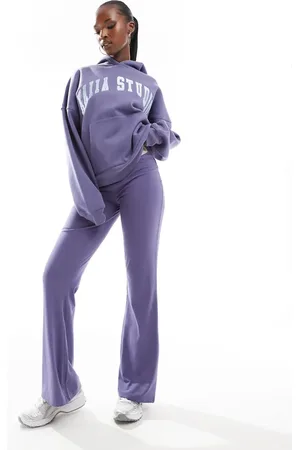 Kaiia Pantalones de campana azules para yoga con logo de Studio (parte de un conjunto)