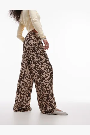 Topshop Pantalones multicolores con estampado de vaca y lazada en la cintura de satén de