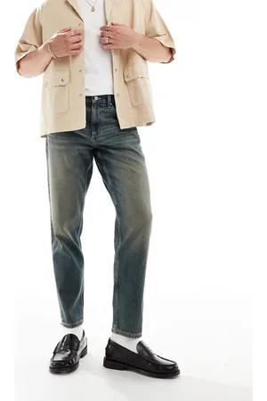 ASOS Vaqueros azules de corte tapered con lavado medio de