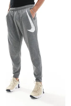 Nike Joggers grises de corte tapered con estampado gráfico de logo Swoosh de Nike-Negro