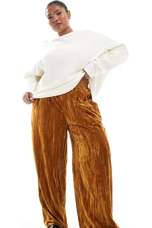 ASOS Pantalones dorados sin cierres de terciopelo rugoso de Curve
