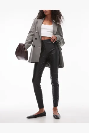 MANGO Leggings negros de corte slim con cinturilla elástica de cuero sintético de