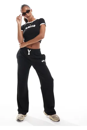 Kaiia Joggers negros de pernera ancha con logo en relieve de (parte de un conjunto)