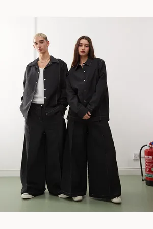 Reclaimed Pantalones negros unisex con pespuntes blancos en contraste de nailon de