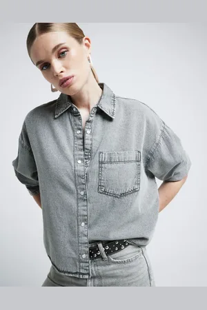River Island Camisa vaquera con diseño recortado de