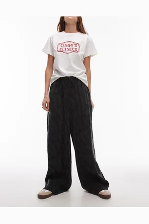 Topshop Pantalones negros con cordón ajustable y patrón floral de jacquard de