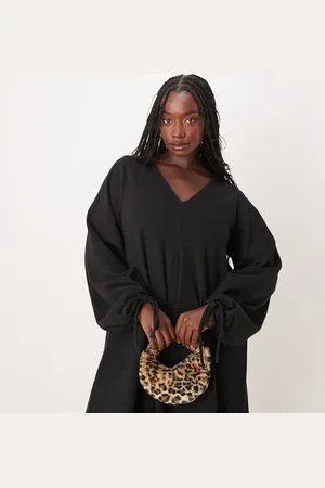 ASOS Vestido corto con cuello de pico, bajo acampanado y lazadas en las mangas de punto muy suave de ASOS DESIGN Curve
