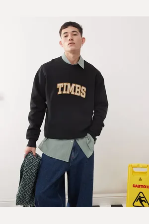 Timberland Sudadera negra con logo de texto en el pecho de bouclé de