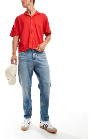 Tommy Hilfiger Vaqueros de corte tapered holgado con lavado medio y detalle de escudo Isaac de -Azul