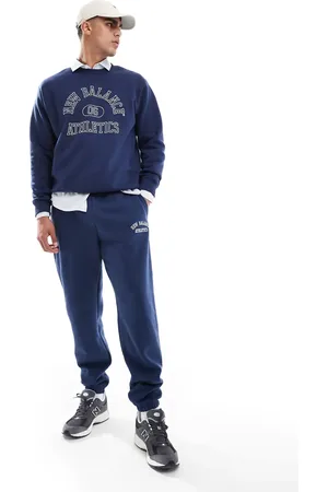 New Balance Joggers con estampado gráfico de felpa Sport Essentials de