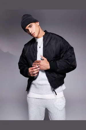 The Couture Club Chaqueta bomber negra extragrande con emblema de