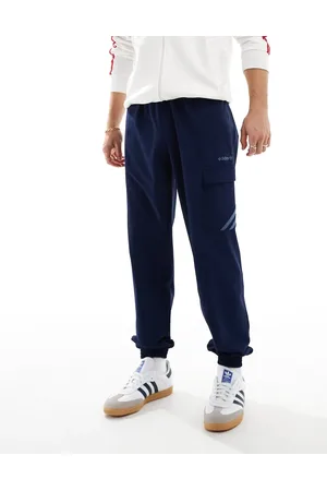 adidas Pantalones azules cargo con bajos ajustados de