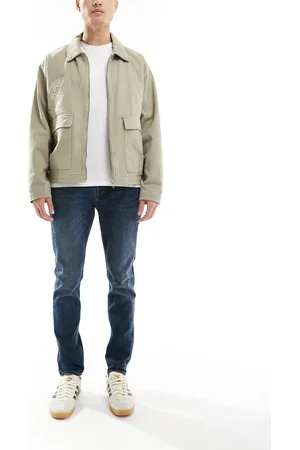 Pretty Green Vaqueros de corte slim con lavado aclarado de