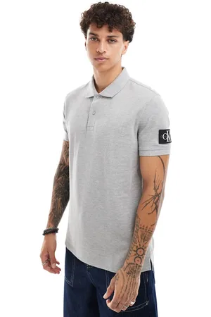 Calvin Klein Polo gris jaspeado con parche de