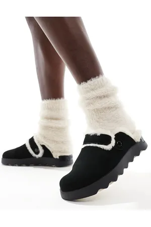 sorel Zuecos negros y beis de ante con ribetes de piel sintética Viibe Cozy de