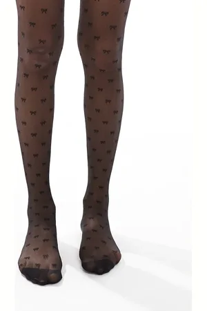 Pretty Polly Medias negras con patrón integral de lazos de