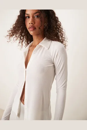 Abercrombie & Fitch Polo de manga larga con botones de canalé transparente de