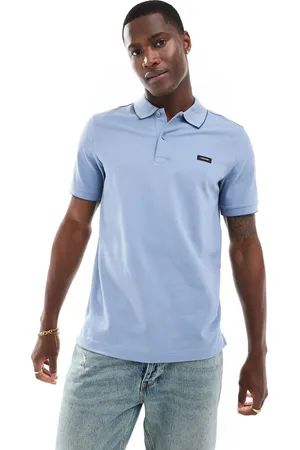 Calvin Klein Polo azul claro elástico con ribetes de piqué de