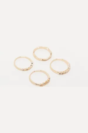 ASOS Pack de 4 anillos dorados con detalles de cristales delicados de