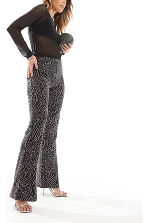 ONLY Pantalones de campana negros con estampado de cebra efecto purpurina de