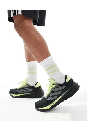 adidas Zapatillas de deporte negras y verde lima Supernova Stride 2 de adidas Running
