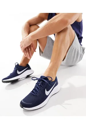 Nike Zapatillas de deporte y blancas Revolution 7 de
