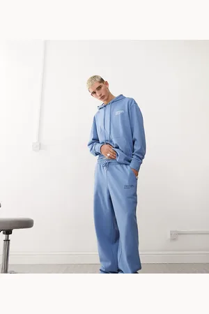COLLUSION Joggers azules de corte skater holgado con estampado de coordenadas de