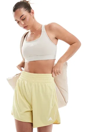 adidas Pantalones cortos amarillos de talle alto de punto Pacer Essentials de