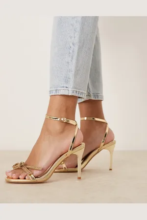 Glamorous Sandalias doradas de tacón de aguja con lazo adornado de