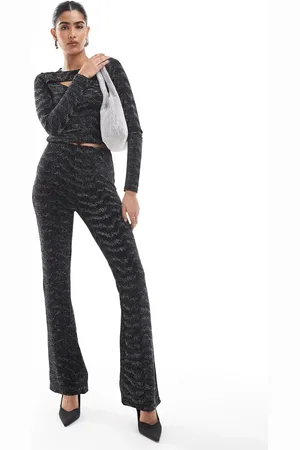 VERO MODA Pantalones negros y plateados de corte acampanado con acabado de purpurina de (parte de un conjunto)