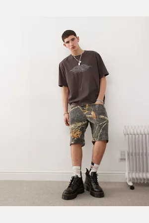 Guess Pantalones cortos negros de estilo carpintero con estampado multicolor de