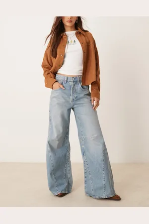 Free People Vaqueros de campana de talle alto y corte holgado con lavado azul medio Eden de