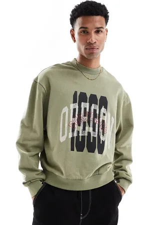ASOS Sudadera verde de corte cuadrado extragrande con lavado ácido y estampado superpuesto de